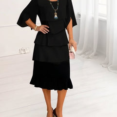 Black ruffle tier midi dress with elbow-length sleeves and layered skirt