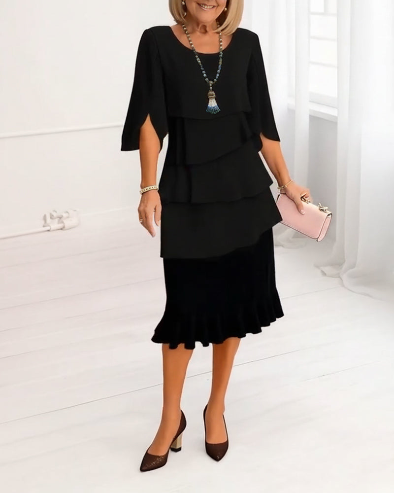 Black ruffle tier midi dress with short sleeves and layered flounce skirt