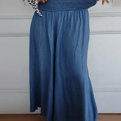 Blue relaxed-fit trousers with elastic waist and long, wide drape