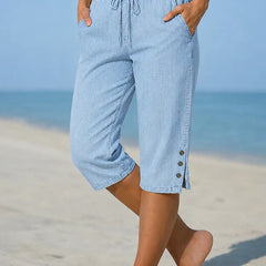 Light blue calf-length capri trousers with drawstring waist and side button details