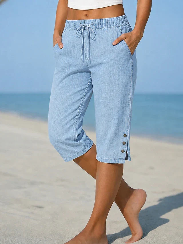 Light blue calf-length capri trousers with drawstring waist and side button details