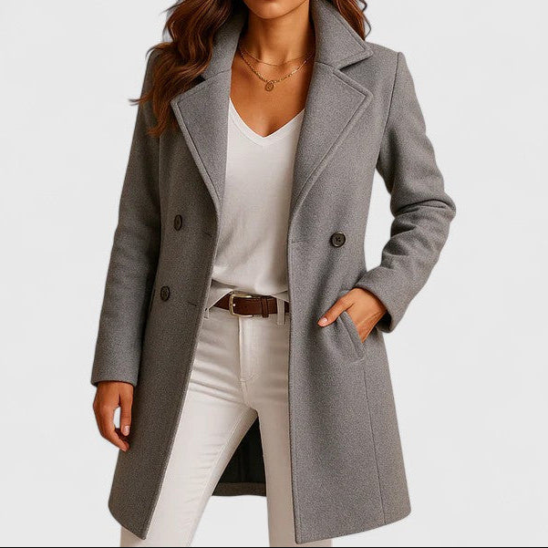Gray long tailored coat with notch lapels, button front, and side pockets
