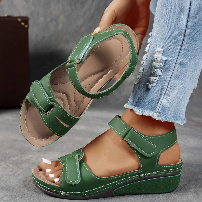 Green supportive wedge sandals with two buckled straps and open toe