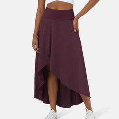 Asymmetric midi skirt in deep plum with high-low hem and draped side panel