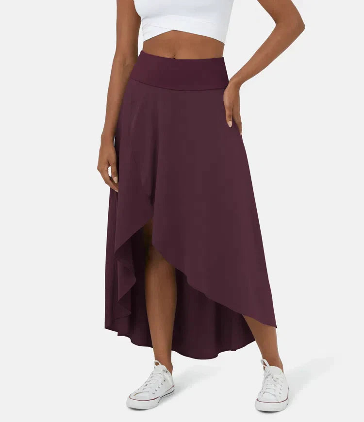 Asymmetric midi skirt in deep plum with high-low hem and draped side panel