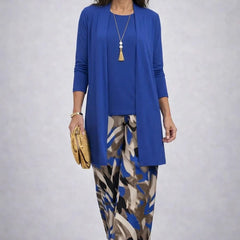 Blue three-piece trouser set with open cardigan and patterned long skirt-style trousers