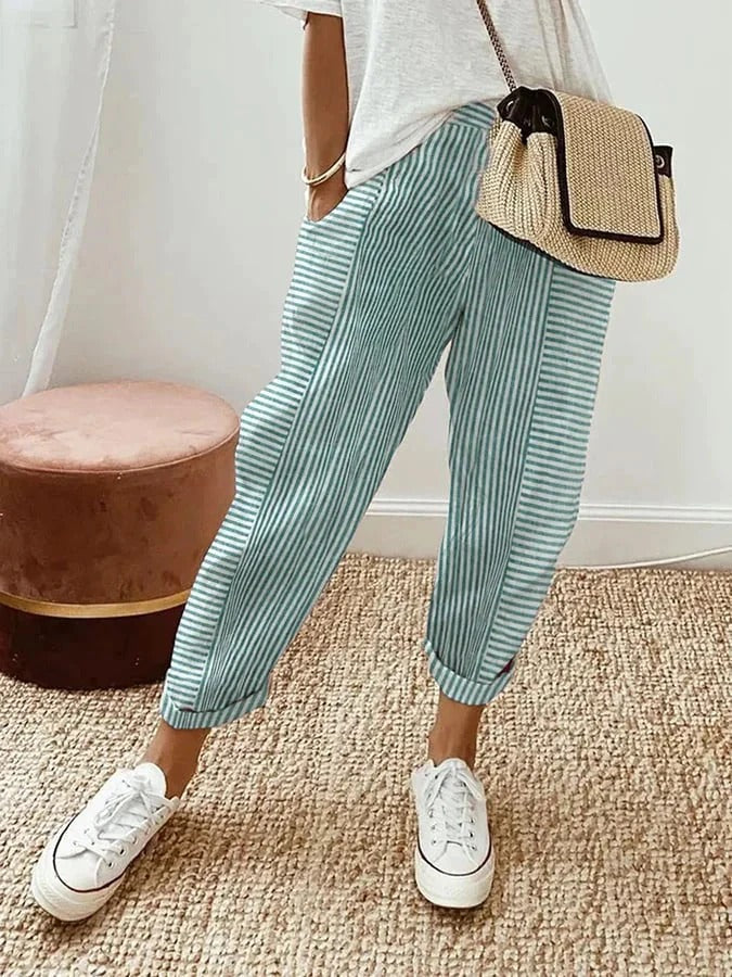 Lightweight striped trousers in green with cuffed ankle hem and relaxed legs