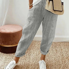 Classic striped trousers, light grey with white vertical stripes and cuffed hems