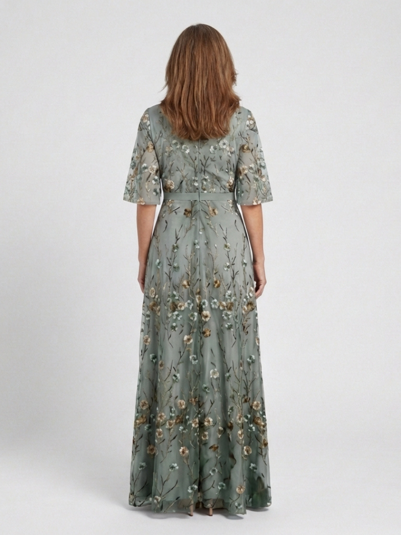 Back view of floral V-neck maxi dress in muted green with short sleeves