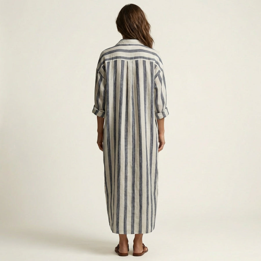 Back view of blue and white striped maxi dress with half sleeves, draped fit