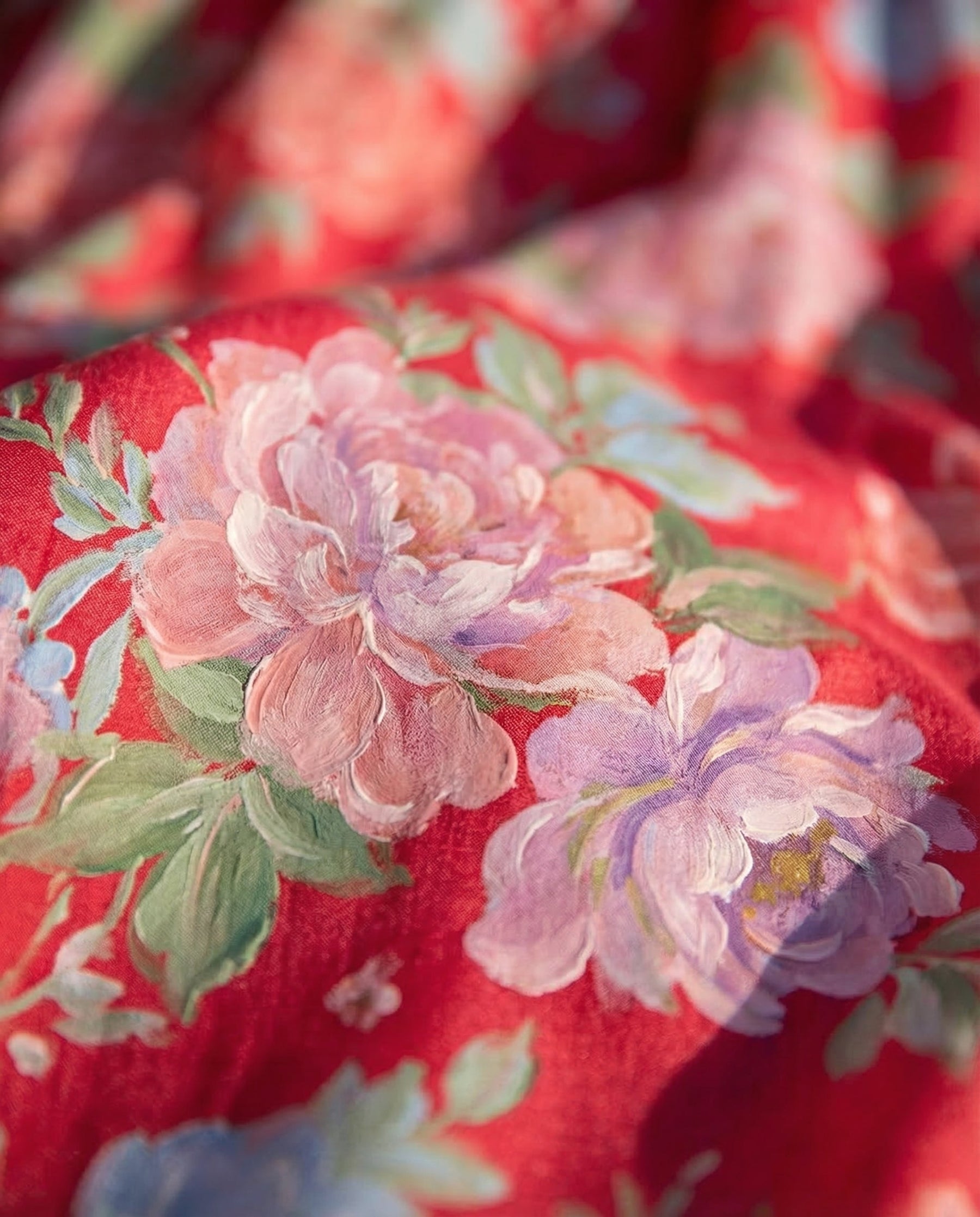 Red floral print fabric close-up