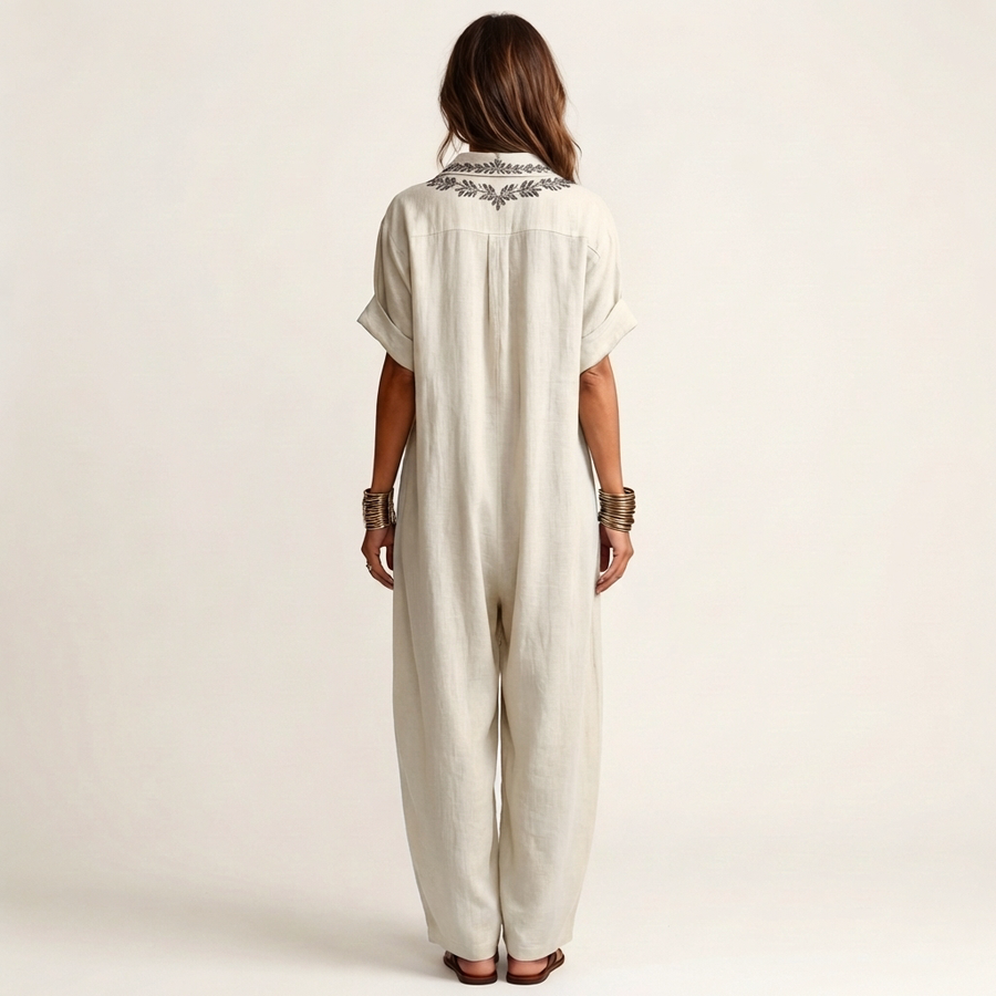 White linen maxi dress back view with embroidered yoke and short sleeves