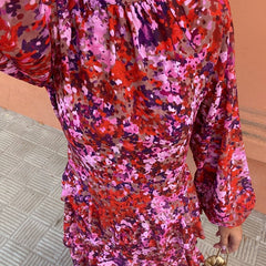 Floral midi dress close-up: ruffled high neckline, gathered waist, long sleeves