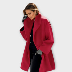 Red wind-resistant coat with notched lapels, long sleeves, and single-breasted front