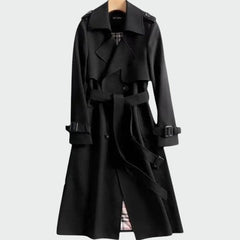Black trench coat front close-up with belt straps, buttoned placket, and shoulder epaulets