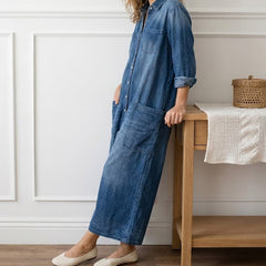 Washed blue denim button-through dress with collar, long sleeves, and front patch pockets