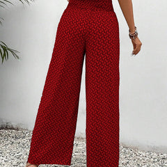 Red wide-leg trousers with shirred waist and micro pattern, straight wide leg.