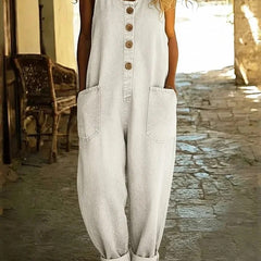 White denim overalls, sleeveless with button front and chest pockets, relaxed wide legs