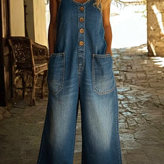 Blue denim overalls, sleeveless with button front and two chest pockets, wide legs