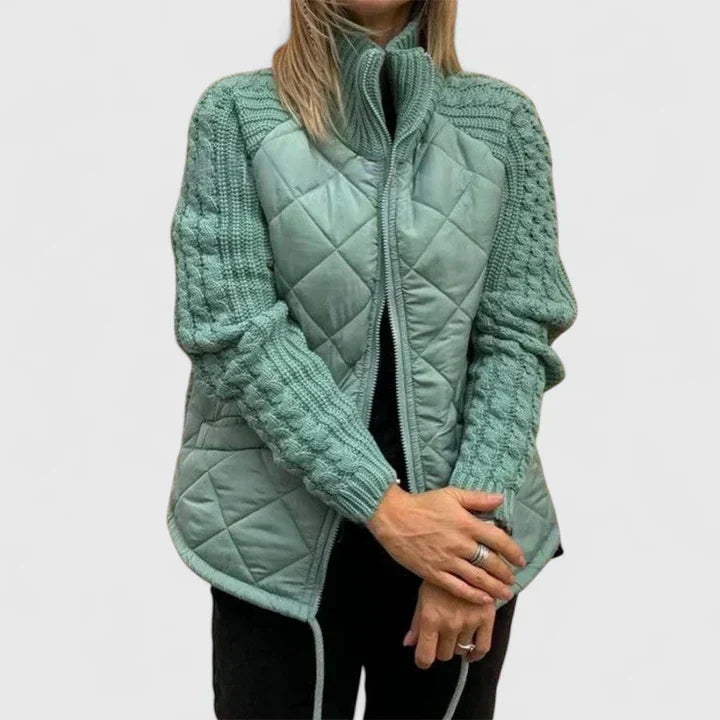 Quilted zip-up jacket in teal green with knit sleeves and stand collar