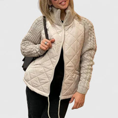Quilted zip-up jacket in beige with knit sleeves and stand collar
