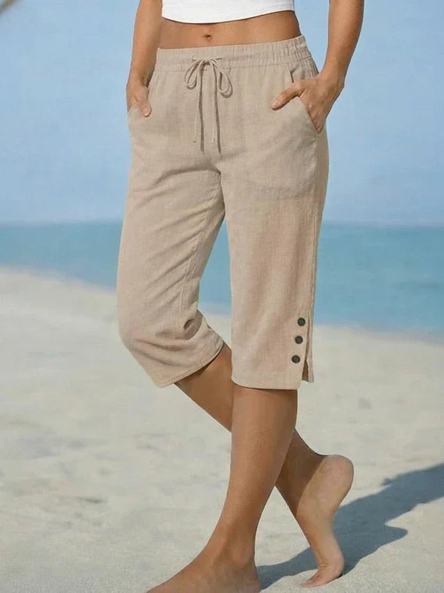 Beige calf-length capri trousers with drawstring waist and side button details