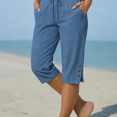Blue denim calf-length capri trousers with drawstring waist and side button details