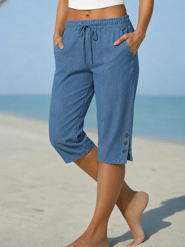 Blue denim calf-length capri trousers with drawstring waist and side button details